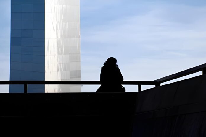 Chronic loneliness A person alone in an urban setting