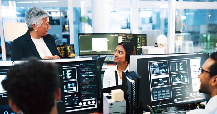 Professionals Professionals in a local office using digital dashboards